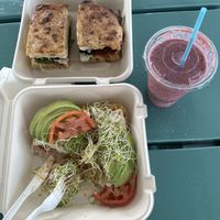 Veggie focaccia sandwich (top left), chipa waffle (bottom left), Hawaiian tropic smoothie (right)  at Ahonui in Kahului