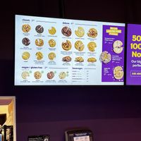 Vegan and gluten free cookies on the bottom of the sign   at Insomia Cookies in El Paso