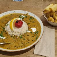 Lentil trifle with oriental curry spice mix, vegan trace cream and fragrant rice (14,90€) and fries (4,00€) at Humbser und Freunde in Furth