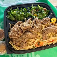 Burdock root stir fry with fried oyster mushrooms and salad.  at Food For Negus in Brooklyn
