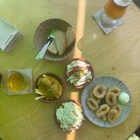 Ensalada rusa (Russian salad), albondigas con almendras (meatballs in almond sauce), calamari, patatas con alioli (alioli potatoes)    at La Vegana Taperia Playa in Torre Del Mar