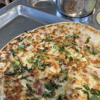 Uttapan. Rice lentil pancake with vegetables  at Honest Restaurant Cleveland in Parma Heights