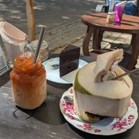 Thai tea with plant milk, choc cake and coconut (used our own straws) at Ball Cafe in Koh Mak