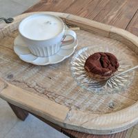 Latte and small cake at On-Ve Vegan Bakery 온비 비건베이커리 in Gyeongju
