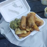 Chips and sausages at Village Fish & Chip Shop in Manchester