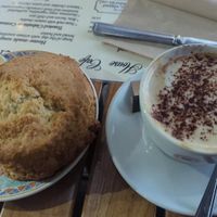 Vegan scone with vegan butter and jam. Cappuccino with oat milk. at Deacon's House Cafe in Edinburgh