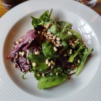 Leafy salad with pine nuts on a bed of avocado and sun-dried tomatoes at Bouchon in Naas