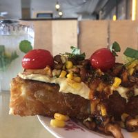 Focaccia with tempeh corn cream and chanterelles  at Lychees in Warsaw