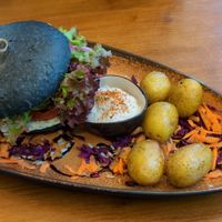 Greek style burger with potatoes and sour cream. at VielSinn in Wismar