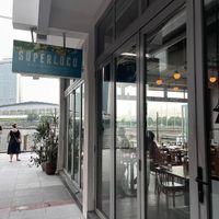 Outdoor signage   at Super Loco - Customs House in Central Singapore