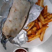 $12.95 vegan meal deal: classic burrito with vegan beef, chipotle salsa, mex chips, plus soft drink or bottle of water at Burrito Bar in Warwick