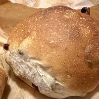 Bun with currants   at Godt Brød Munch Brygge in Oslo