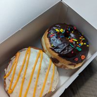 Orange creamsicle and chocolate sprinkle donuts at Bitchin Donuts in Albany