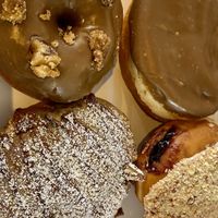 Butter pecan, salted caramel apple, French toast roll, blueberry cronch  at Bitchin Donuts in Albany