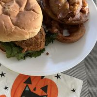 Chicken cluck sandwich with ranch dressing and onion rings   at Bitchin Donuts in Albany