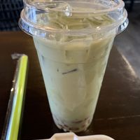 Motcha with Oat milk I believe. Just thought it was red round boba. Believe they were heart shaped. Nice little touch to go with the Hello Kitty themed matcha.  at Bitchin Donuts in Albany