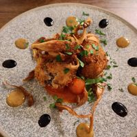 Mushroom arancini on a giant plate at L'Osteria Italiana in York