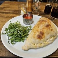 Vegan calzone (containing broccoli, green beans, tomatoes, and mushrooms)...but with dairy cheese! at L'Osteria Italiana in York