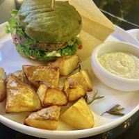 fish burger with potatoes  at PLANTS Kitchen & Bar in Almaty