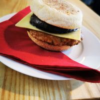 Muffin with mushroom sausage cheese and tomato relish (vegan) at Door to the Cosmos in Lowestoft