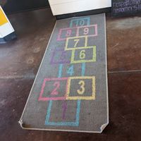 Hopscotch rug leading up to register at NUM NUM BOBA in Reno