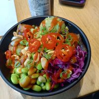 Falafel Bowl, with red siracha, peanuts, scallions, and peppers added at Island Poké in Nantes