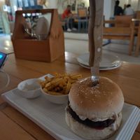 Vegan burger with fries at Beatles Cafe in Rishikesh