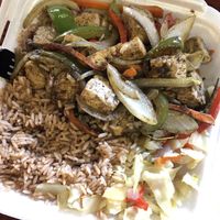 Jerk Tofu with cabbage and peas and rice  at Island Grill & Pub in Rock Hill