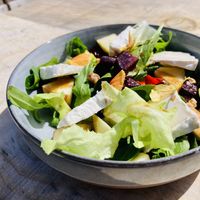 Salad with FRENCHIEZ cashew cheese (Brie style)  at Green Moustache in Gradil