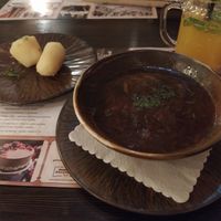 Beetroot and mushrooms soup served with boiled potatoes at Bernelių užeiga in Vilnius