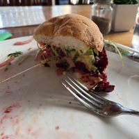 The best, most flavorful plant based burger, made in house, and on a GF bun.   at Organic Farmers Table in Sarasota