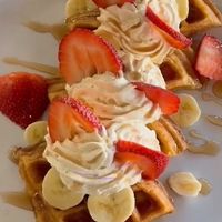 Vegan, gluten-free waffles with coconut whipped cream! Amazing!   at Organic Farmers Table in Sarasota