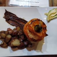 Pepper bell with vegan chorizo rice and vegetables filling with roasted potatoes at Organic Farmers Table in Sarasota