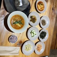 Vegan ramen ,black rice ,rice cake things ,jalapeño,pickled cucumbers, bean sprouts , kimchi,something else, and shredded nori  at Sulgodang in Busan