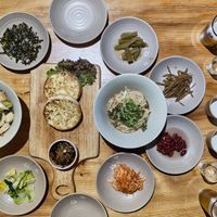 From the right: Sticky sweet potato and mushrooms noodles, tofu steaks, soy based noodles. All around free condiments. at Sulgodang in Busan
