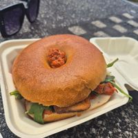Sun dried tomato pesto, smoked tofu and aragula bagel at Massolit Bakery & Cafe in Krakow
