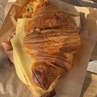 Cheese croissant sandwich with vegan ham and pesto  at Bad Attitude Bread in Toronto
