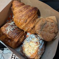 Pizza croissant, cheese croissant, almond chocolate croissant, coffee cake muffin at Bad Attitude Bread in Toronto