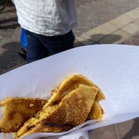 Socca in paper from the markets  at Socca Du Cours    in Nice