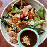 Szechuan spicy eggplant stir fry over rice noodles with side of peanut sauce   at Pho Hong in Burlington