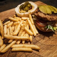 Vegan burger with pickles and jalapeños on a Sunday at Karmer Traders Hostel in Kampot