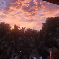 Sunset from the rooftop at Karmer Traders Hostel in Kampot