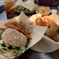 Portobello mushroom with sweet potato fries (front), onion rings (right), fries and ranch (back right), huge wrap (left). Tea was from a different establishment in the food court. at Healthy Junk in Anaheim