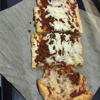 Pepperoni Pizza (already taking a bite!) at Healthy Junk in Anaheim