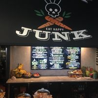 The front of the restaurant. It’s inside a building with big letters on the front that say, “Good Food”. at Healthy Junk in Anaheim