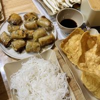 Enoki mushrooms, spring rolls, rice noodles, and tofu sheets that softened in the soup  at Chinh bùi food-Cơm Gà Hội An-Lẩu Nướng-đồ ăn nhanh in Hanoi