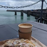 Cherry and almond croissant with oat latte and fab views at Harbour Coffee Co in Folkestone