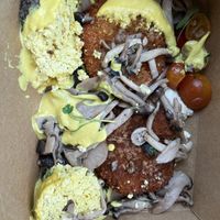 The eggs Benny take away meal got tossed around (“eggs” feel off to the side) but YUM!   at Heirloom in Vancouver