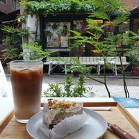 Earl Grey and chocolate cake with an iced soy latte, right at the window seat at Moonggoojeom Vegan Bakery in Busan