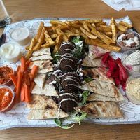Falafel plate with dips, hummus, pita, french fries at Koshary Corner in Baltimore